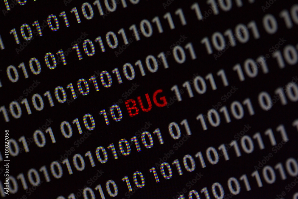 'Bug' word in the middle of the computer screen surrounded by numbers zero and one. Image is taken in a small angle. 'Bug' word in the middle of the computer screen surrounded by numbers zero and one. Image is taken in a small angle.
