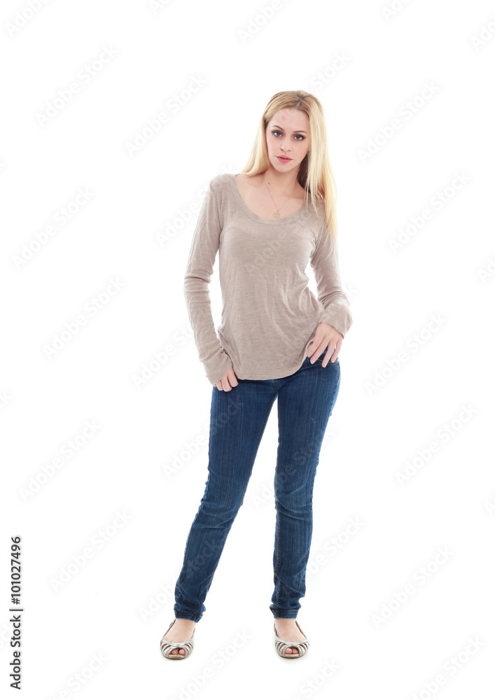 beautiful young woman with long blonde hair wearing a long sleeved cream shirt and gold necklace. standing pose, isolated on white background. beautiful young woman with long blonde hair wearing a long sleeved cream shirt and gold necklace. standing pose, isolated on white background.