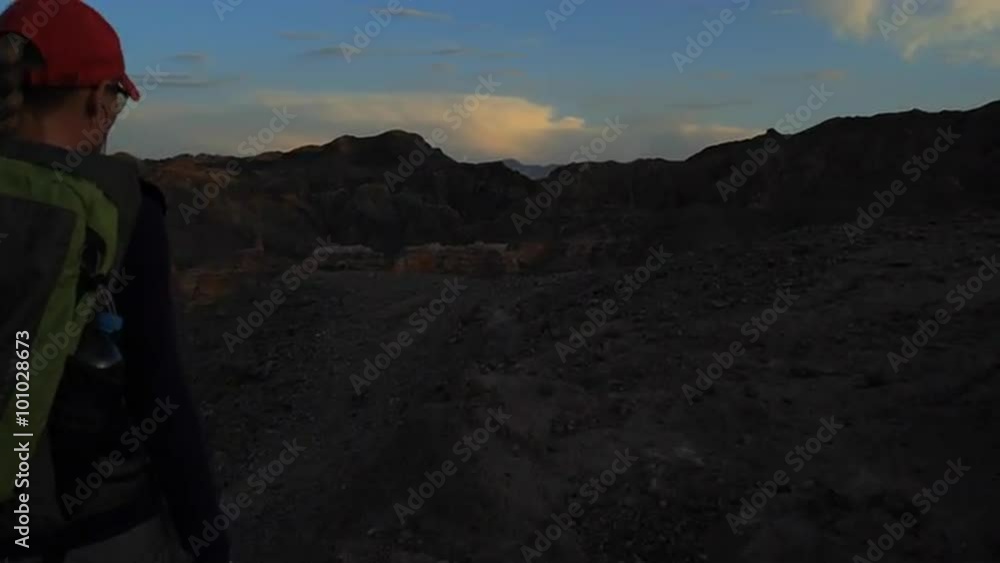 Young girl walking through the Canyons at sunset
Young girl walking through the Canyons at sunset