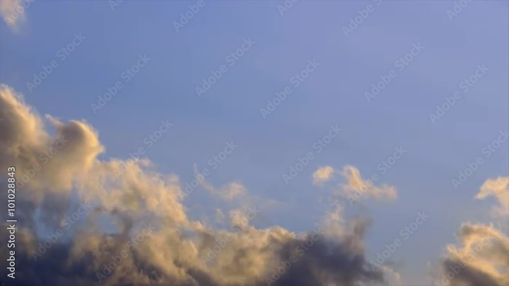 A time-lapse video of clouds moving against a blue sky in the sunset on a sunny evening.
A time-lapse video of clouds moving against a blue sky in the sunset on a sunny evening.
