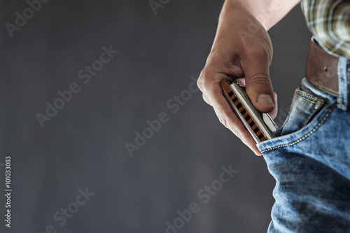 Blues harmonica in the pocket photo