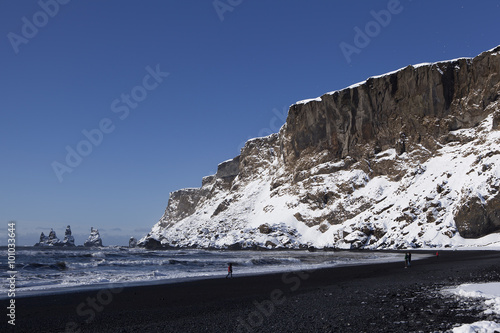 Wide lens capture of the three pinnacles of Vik, Iceland in wint photo