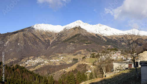 Zambla village and Menna peak in winter landscape, Bergamo, Ital
