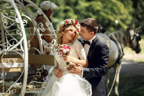 Romantic fairy-tale wedding couple bride and groom hugging in ma