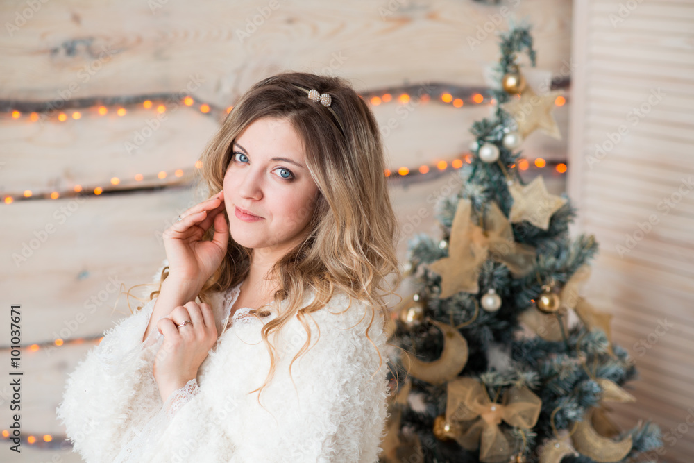 Beautiful girl in white dress sitting near a beautiful tree Beautiful girl in white dress sitting near a beautiful tree