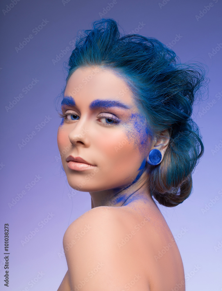 Beautiful fashion woman with bright color face art. Paint on face. Creative portrait Beautiful fashion woman with bright color face art. Paint on face. Creative portrait