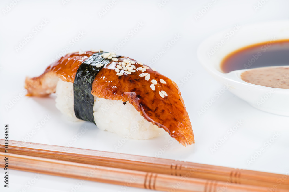 Image of nigiri sushi over white background with chopsticks and Image of nigiri sushi over white background with chopsticks and