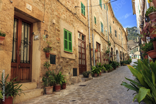 Cobbled street with her pots and plants decorating the houses entraces  Valldemossa  Mallorca  Spain.