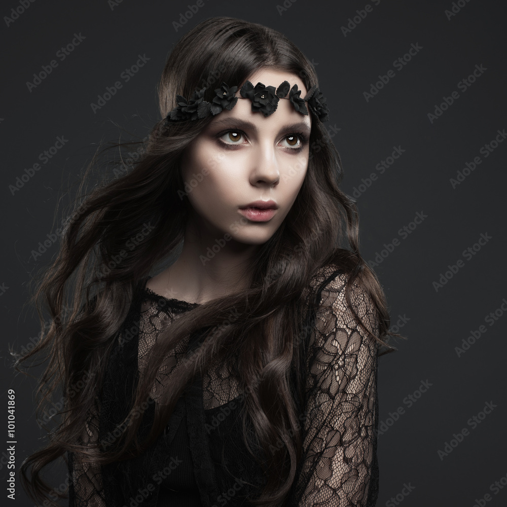 Studio portrait of a beautiful girl in Gothic style