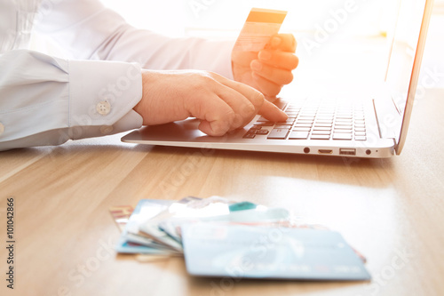 Businessman shopping online with a credit card