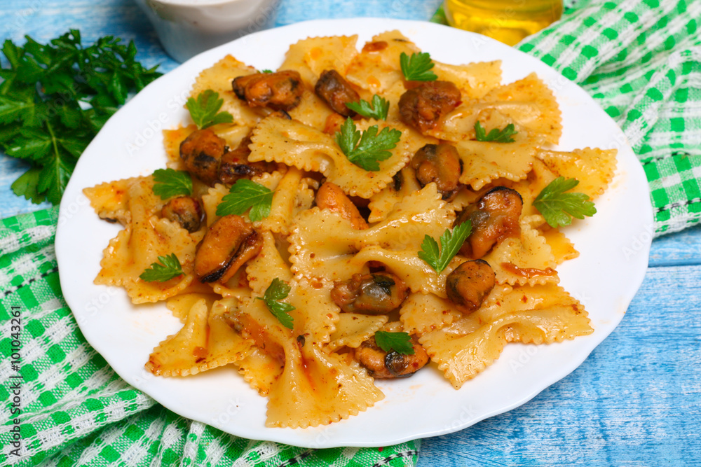 pasta with mussels and parsley on a wooden background pasta with mussels and parsley on a wooden background