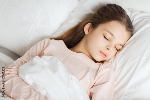 girl sleeping in bed at home
