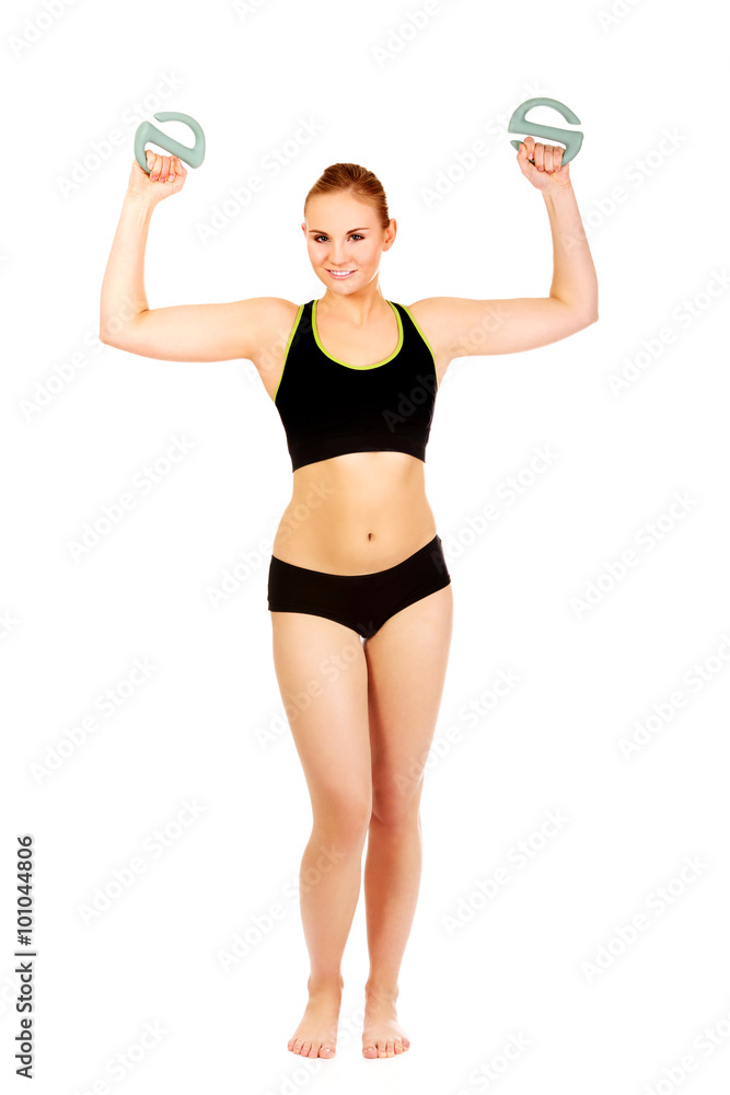 Young fitness woman exercising with weights Young fitness woman exercising with weights