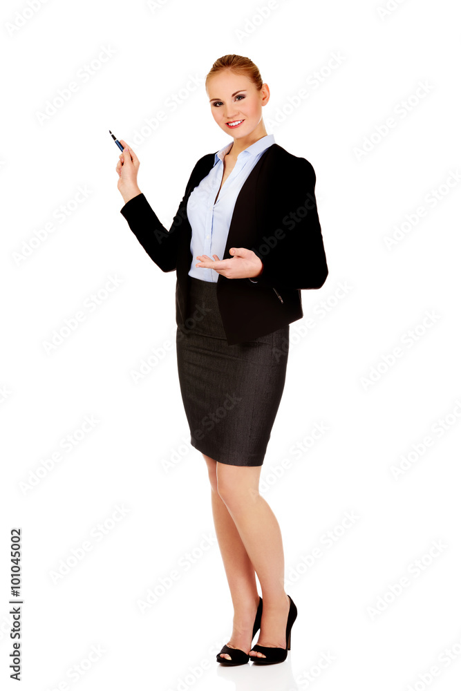 Young business woman pointing for copyspace or board Young business woman pointing for copyspace or board