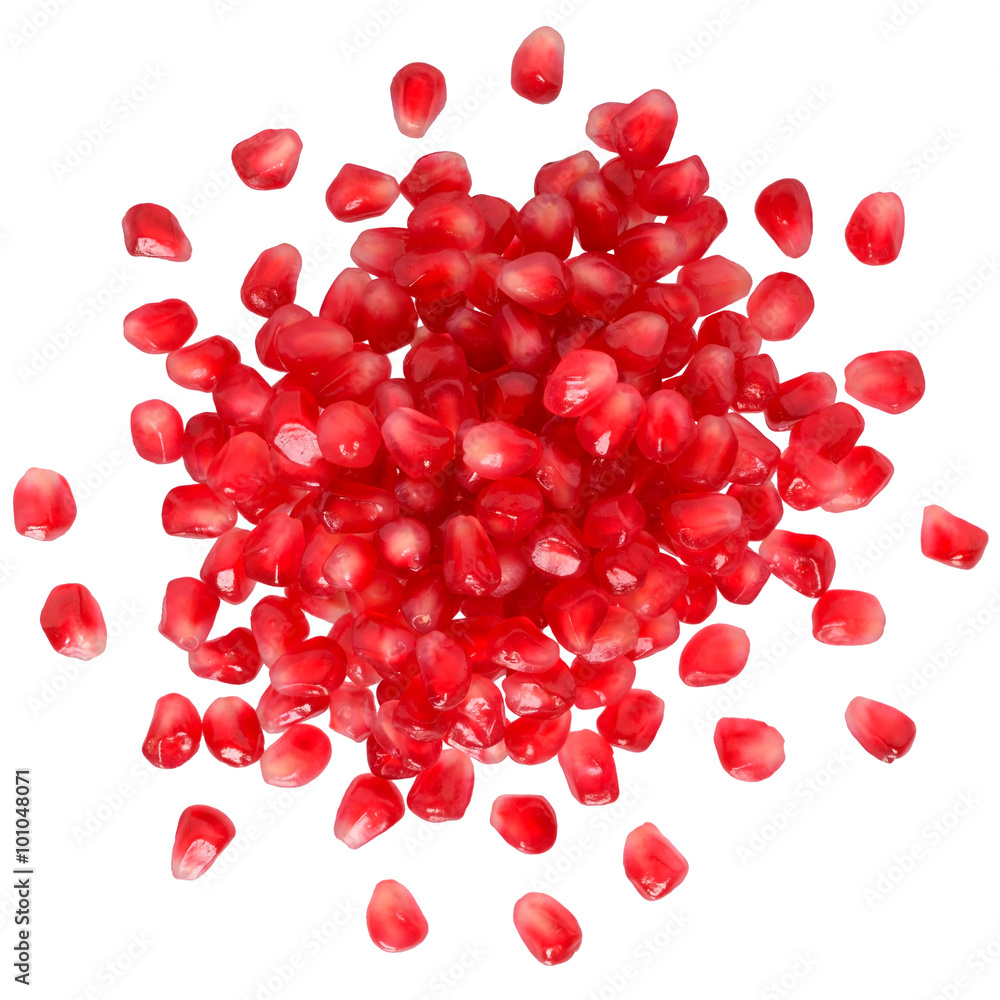 Pomegranate with scattered grain top view Pomegranate with scattered grain top view
