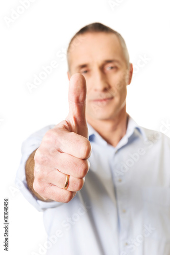 Mature man gesturing ok sign