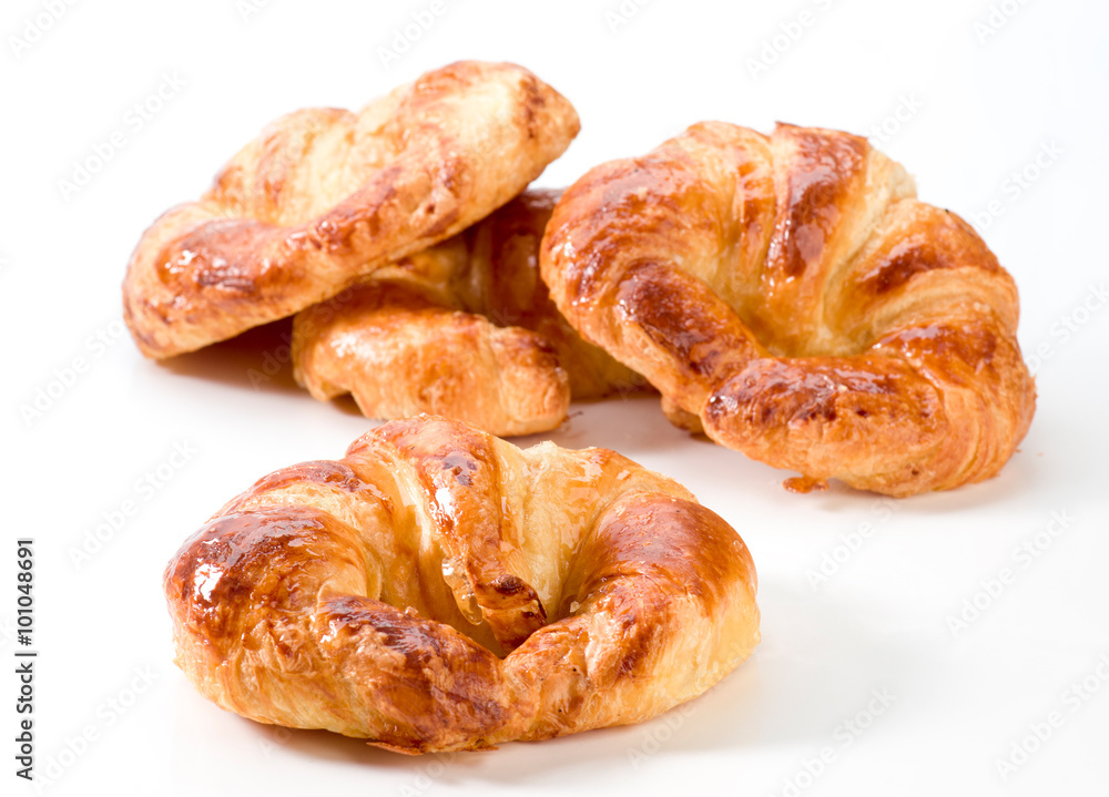 fresh croissants with honey coverage