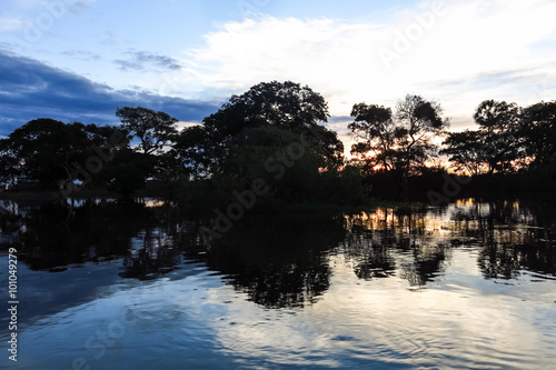 Sunset. Boat Crossing the Amazon.