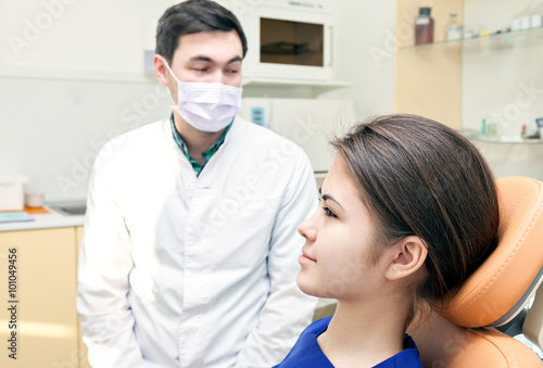 examination at the dentist s office. patient and dentist