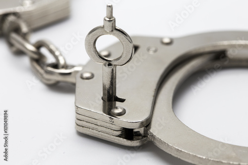 Close-up of key in handcuffs