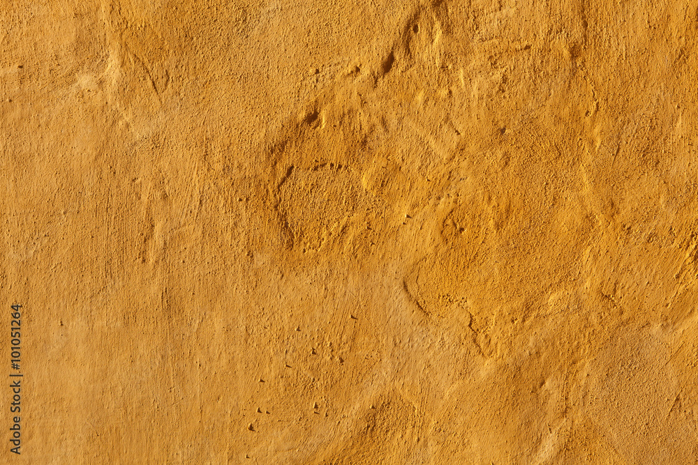 Yellow stucco wall. Background texture