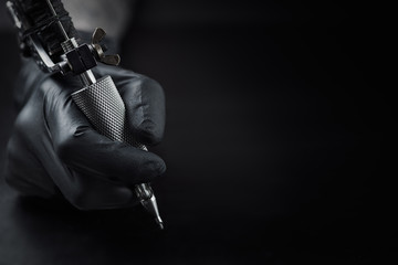 tattoo machine dark background