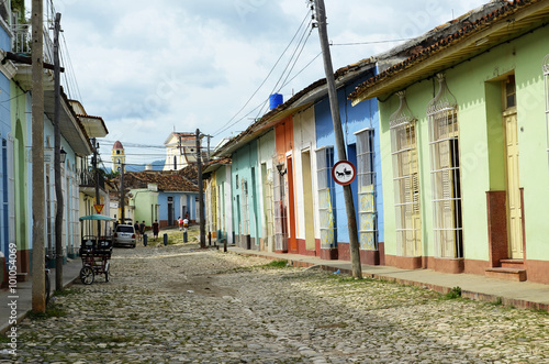 Typical street in Trinidad (Cuba), with coloured houses and Saint Francis church as a background. © jmubalde