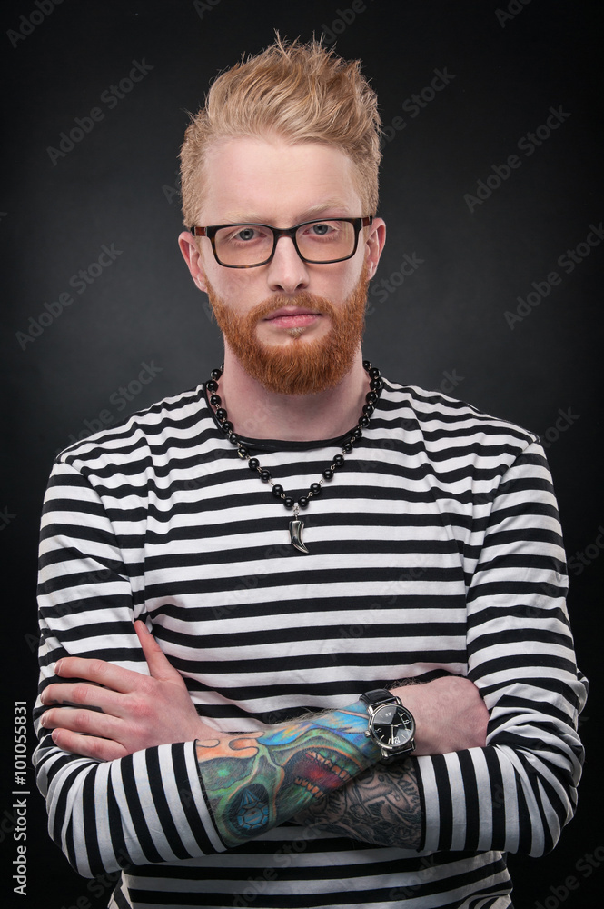 redhaired guy with a red beard redhaired guy with glasses tattoos on  the hands Stock Photo  Adobe Stock