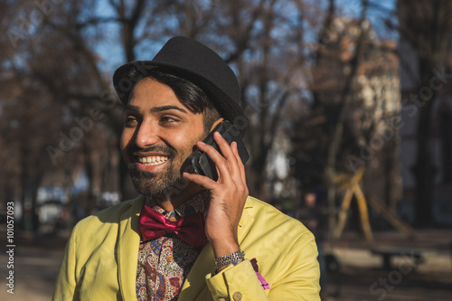 Indian handsome man talking on phone