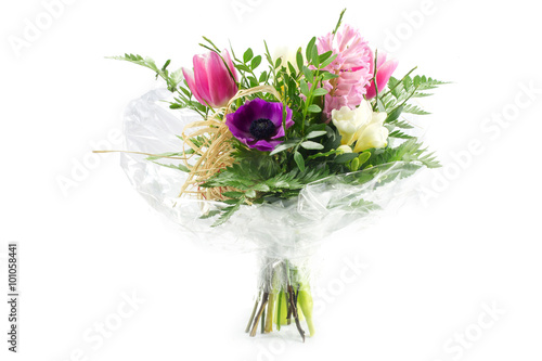 Fotografi bouquet in cellophane with pink purple flowers, isolated on white