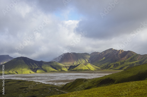 Lake and moss-covered volcanic mountains. Landmannalaugar. Icela photo