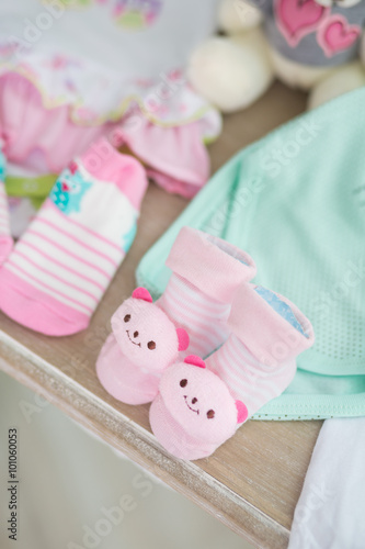 Small shoes for unborn baby in the belly