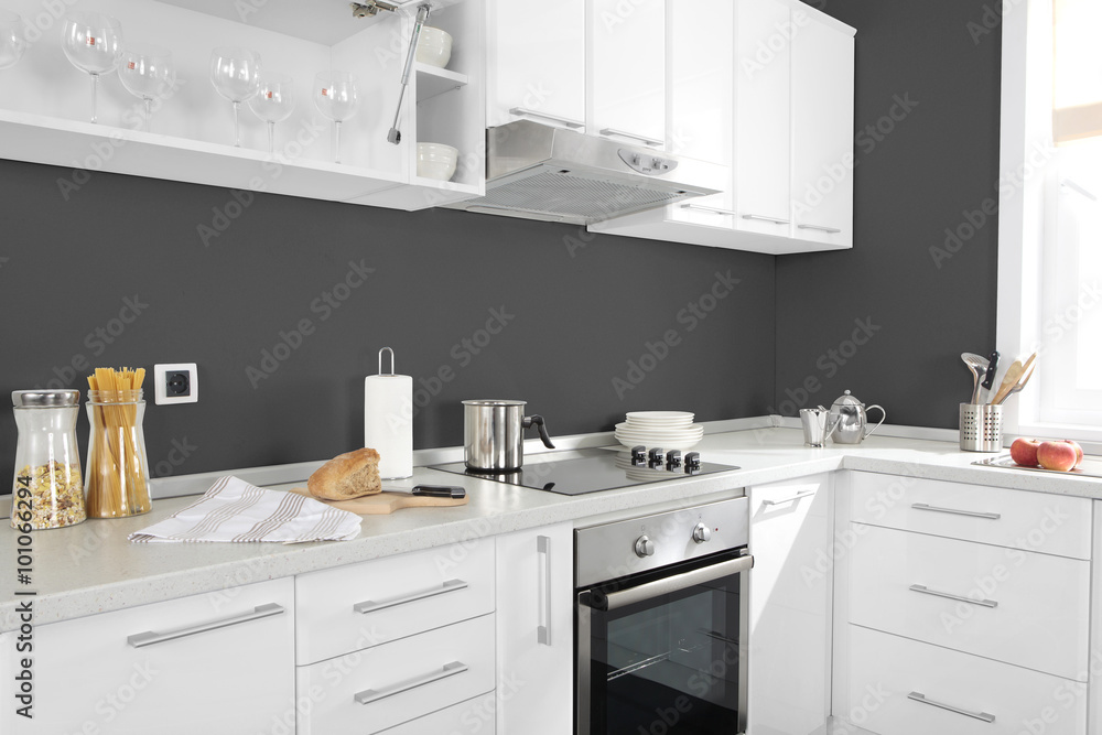 Part of modern kitchen with electric stove oven details, drawers Part of modern kitchen with electric stove oven details, drawers