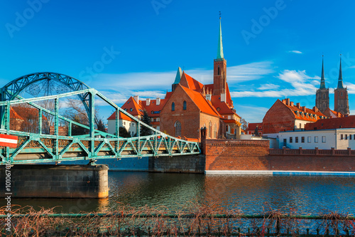 Tumski Bridge and Island with Cathedral of St. John and church of the Holy Cross and St. Bartholomew in the morning in Wroclaw, Poland