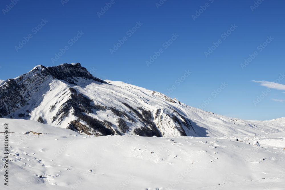 Winter mountains after snowfall at sun day