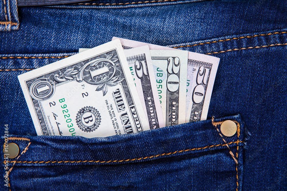 the American dollars are in the pocket of jean trousers the American dollars are in the pocket of jean trousers
