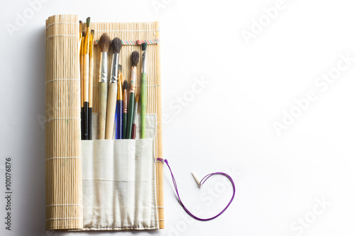 Artistic, artist, art. Used artist paintbrushes mastehin on white background.  photo