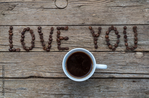 LOVE YOU coffee beans on wooden background photo