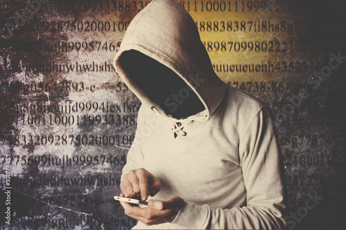 hooded anonymous computer hacker