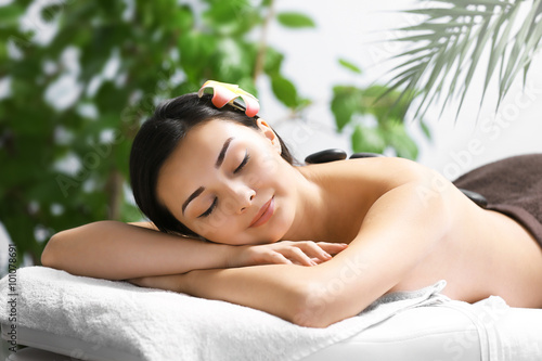 Beautiful young woman relaxing at beauty spa