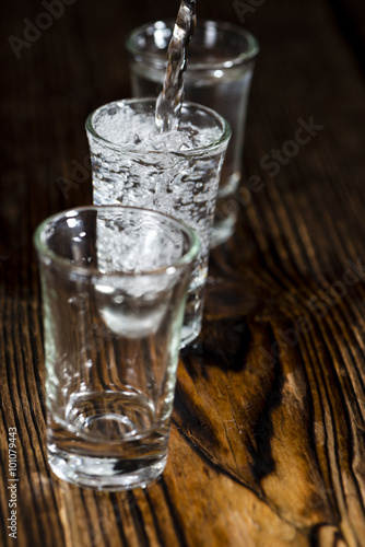 Pure Vodka (on an old wooden table)