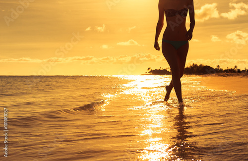 Girl walking on the beach.