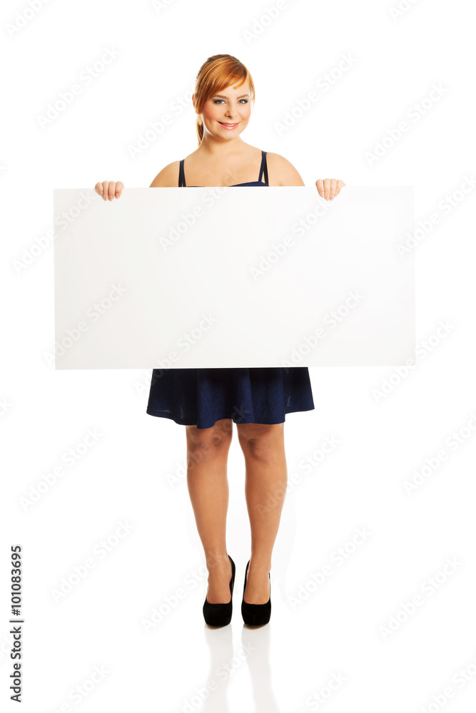 Large woman holding a white board Large woman holding a white board