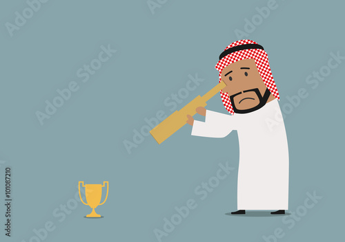 Arabian businessman looking at prize