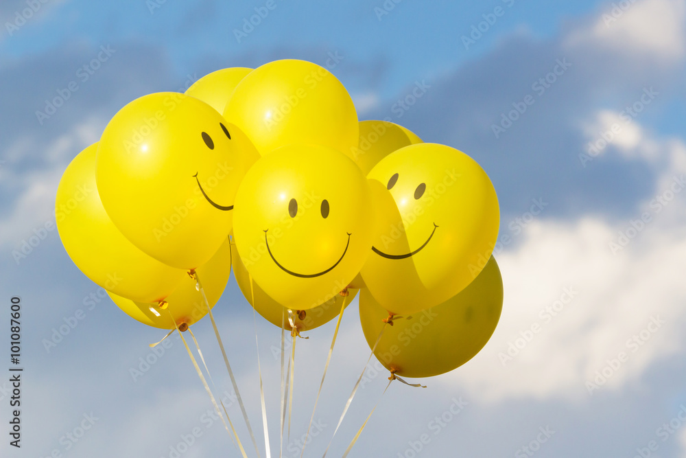 Yellow balloon smile with sky and clouds. Stock Photo | Adobe Stock