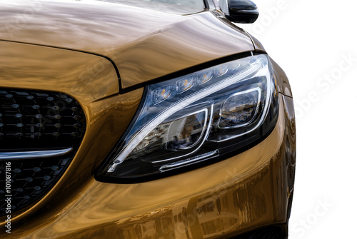 Closeup headlights of ca and Car exterior detail with White back