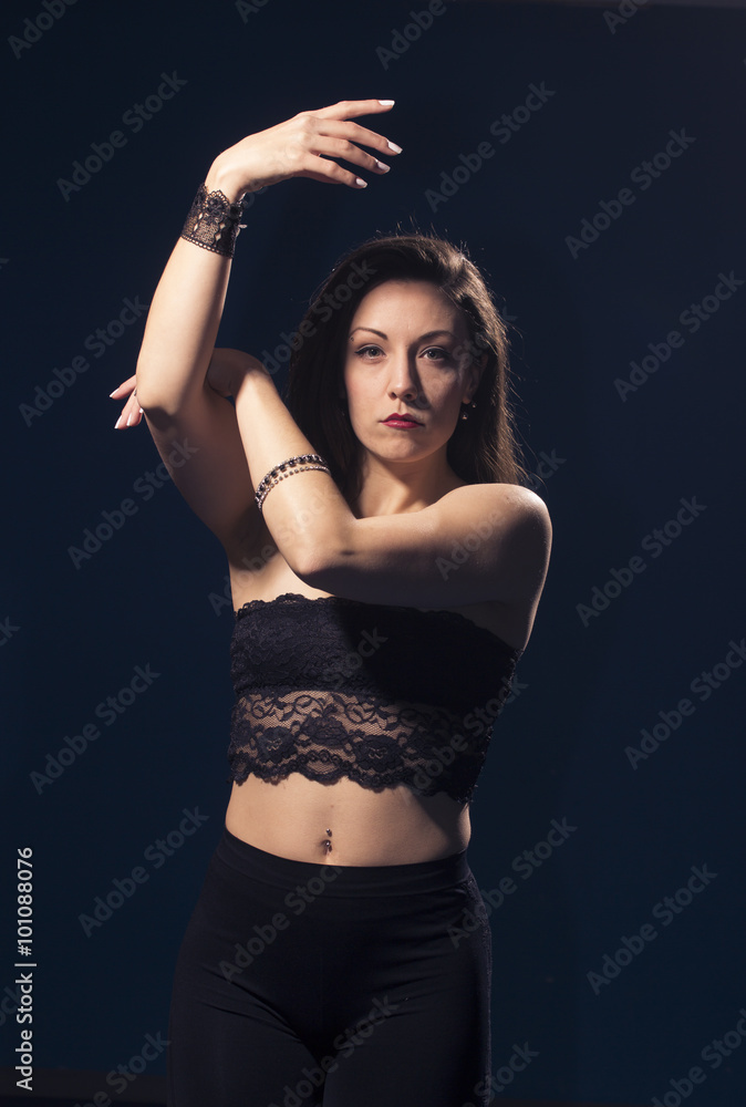 Fototapeta premium One girl posing in Vouge dance style.