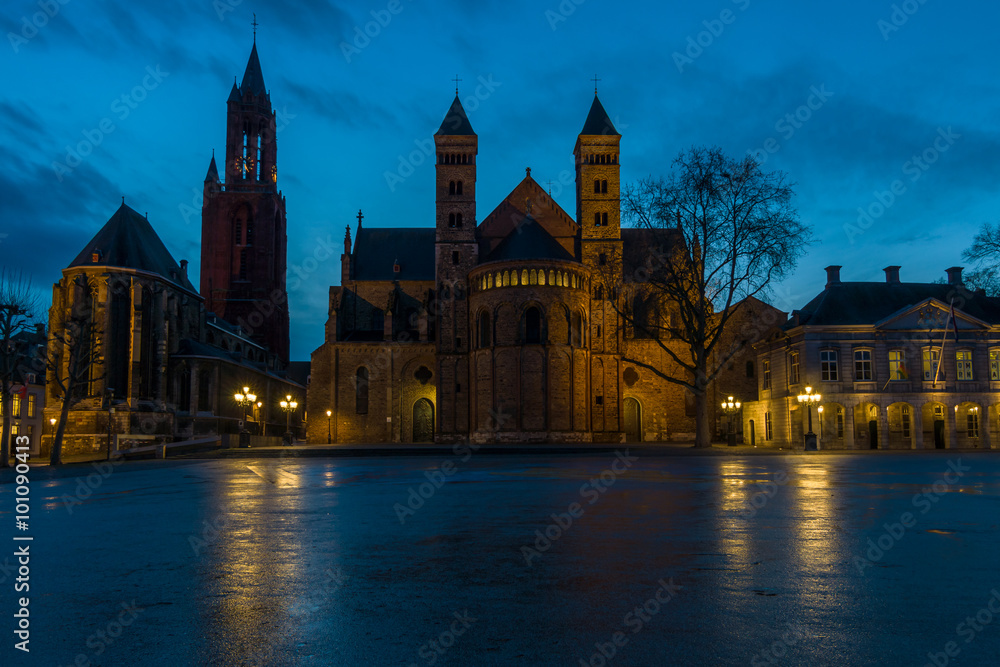 St. John's Evangelical Church (Sint Janskerk) and the Basilica of Saint Servatius (right) at Vrijthof Square. Evening light.