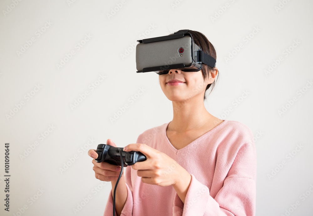 Young Woman play with the virtual reality device Young Woman play with the virtual reality device