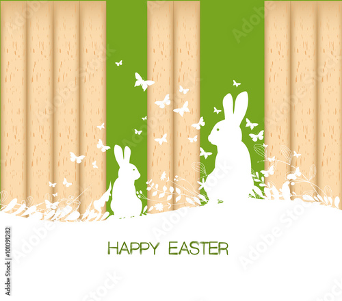 Easter greeting card with rabbit  on the wooden background photo